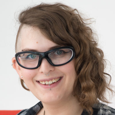 A headshot of June Epstein, a student from Cohort 15 at HackerYou